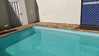 In the pool, a Latina redhead takes a big anal creampie from monster cock