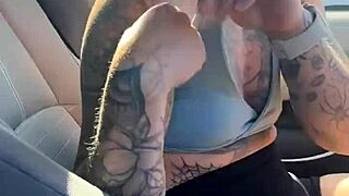 girl struggling with sports bra in gym parking