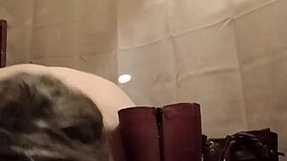 Slave Flashes Boots While Bent Over In Exhibitionist Scene