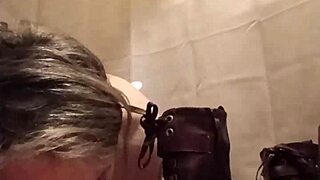 Slave Flashes Boots While Bent Over In Exhibitionist Scene