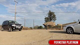 Samantha Rone playfully tends Mindi Mink's bushy garden outdoors