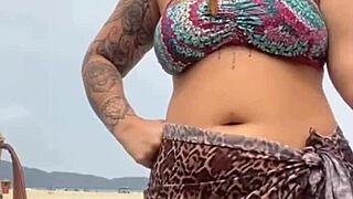 young african girl gets naked on beach, grabs guy's hard cock