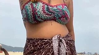 young african girl gets naked on beach, grabs guy's hard cock