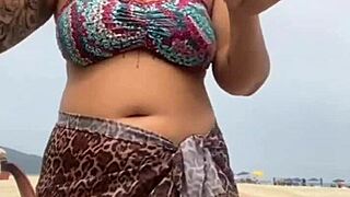 young african girl gets naked on beach, grabs guy's hard cock