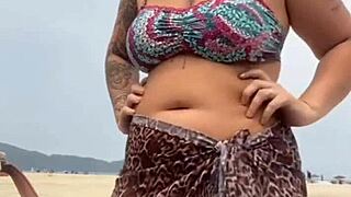 young african girl gets naked on beach, grabs guy's hard cock