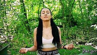 girl next door brunette with ponytail meditating in nature.