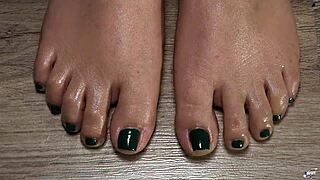 A close-up of my oiled toes with green nails for your fetish fantasy