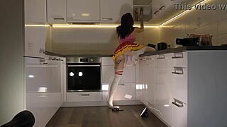 hottest redhead tattooed cheerleader in over knee socks shows see through panties in the kitchen