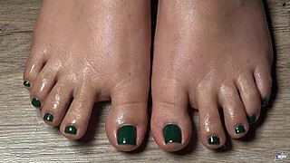 A close-up of my oiled toes with green nails for your fetish fantasy
