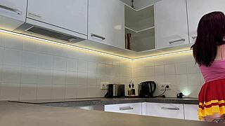 hottest redhead tattooed cheerleader in over knee socks shows see through panties in the kitchen