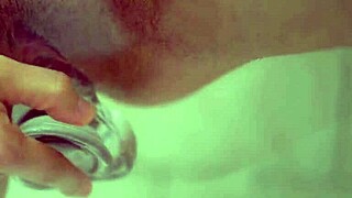 busty redhead masturbates with clear dildo closeup