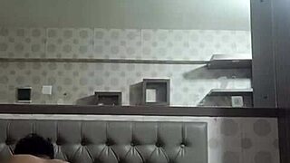 Young woman explores self in boarding room with stepmother