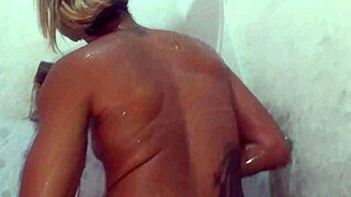 Beautiful wife in lingerie shows pierced nipples in bath