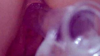 busty redhead masturbates with clear dildo closeup