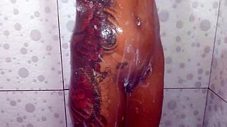 Beautiful wife in lingerie shows pierced nipples in bath