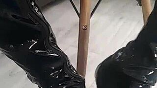veve performs balloon popping in latex stockings