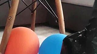 veve performs balloon popping in latex stockings