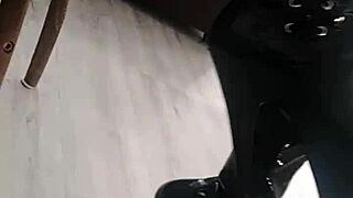 veve performs balloon popping in latex stockings