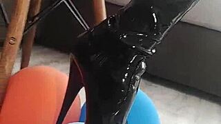 veve performs balloon popping in latex stockings