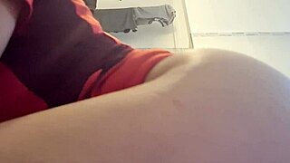 The hot girl shakes her big ass seductively while wearing panties during masturbation.