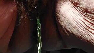 Granny uses cucumber in hairy pussy!