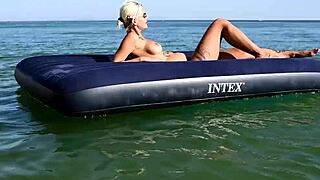 nude beach girl with big boobs and dolphin tattoo enjoys public outdoor fun