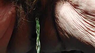 Granny uses cucumber in hairy pussy!