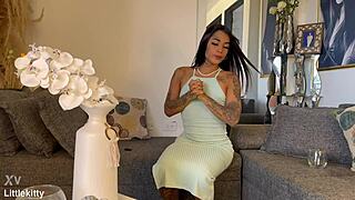 Crossdressing person fills glass with liquid