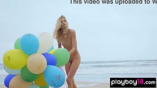 Skinny milf undresses naked playing with balloons on beach