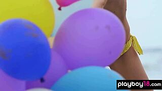 Skinny milf undresses naked playing with balloons on beach