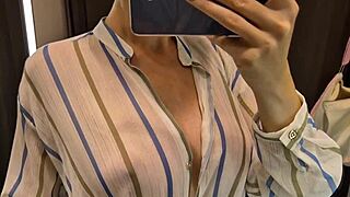 big tits woman tries on sexy see-through outfit in public dressing room while being spied on