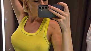 big tits woman tries on sexy see-through outfit in public dressing room while being spied on