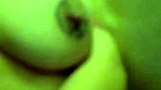 Woman with pierced nipples teases huge tits and wet pussy