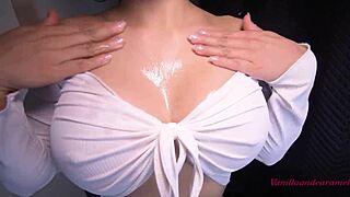 Busty latina gives oiled striptease