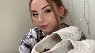 Girl removes sneakers to show bare feet