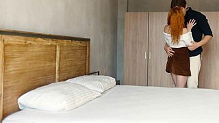 romantic sex of redhead curls on the bed