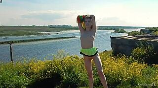 spunky teen 18+ model gets naked while outdoors