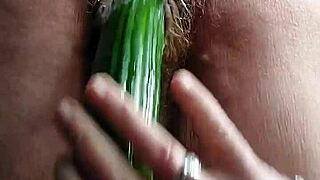 Granny fucks hairy pussy with cucumber