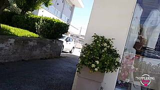 Kinky woman flashes pierced nipples and pussy on public street