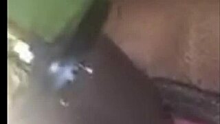 Why does this ebony babe moan while playing with her wet pussy using a big dildo?