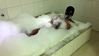 Morena sensually bathes in foam, showcasing her big pussy.