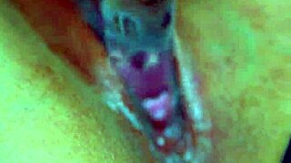 Girls' puffy shaved pussy gets wet with glass dildo in sensual amateur play