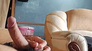 Young Latina Teases with Panties While Stroking in Living Room