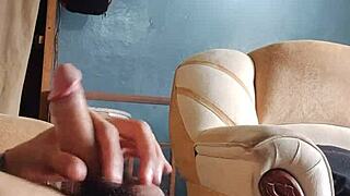 Young Latina Teases with Panties While Stroking in Living Room