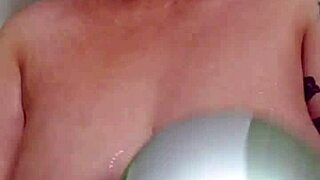 Blonde beauty bathes with her big natural tits