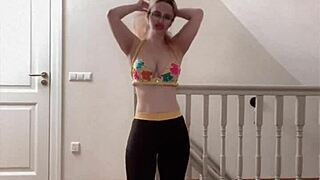 beautiful belly dancer performing with music and glasses on