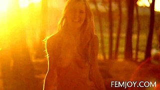 is this german busty blonde teen corinna posing nude at sunset, showing her big tits outdoors?