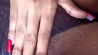 The ebony beauty fingered her pierced pussy relentlessly