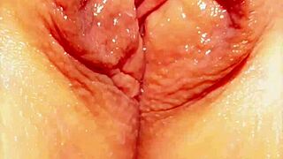 Feeling exposed, the mature woman spreads her big wet vulva outdoors