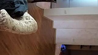 Couple Using Spy Cam in Living Room